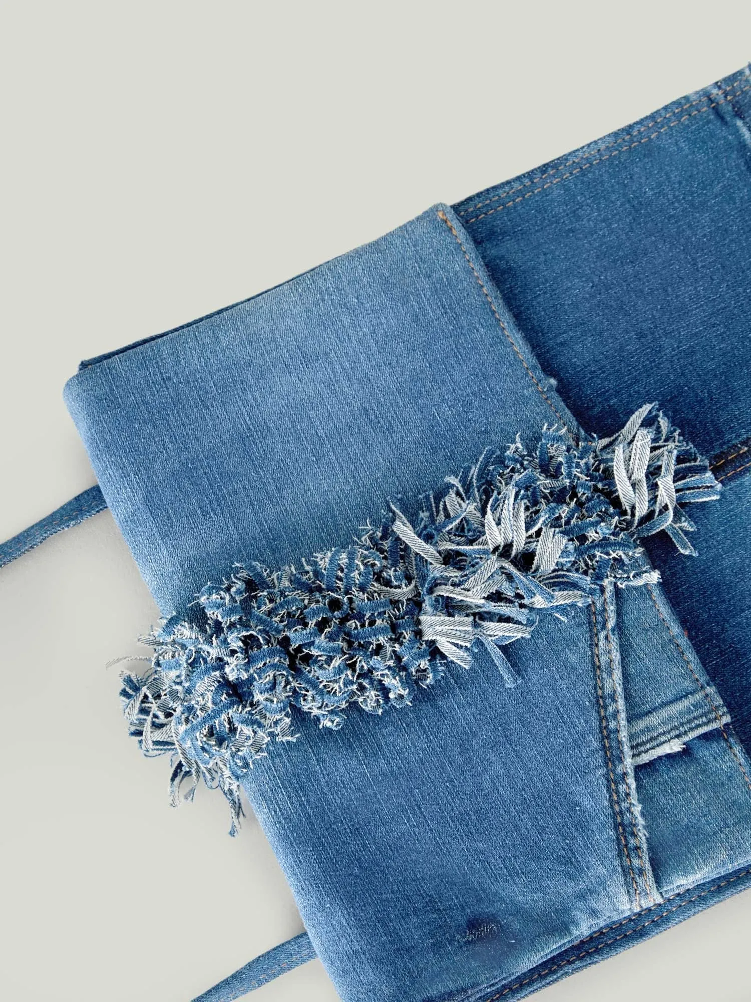 DENIM MESSENGER BAG WITH CENTRAL FRINGES
